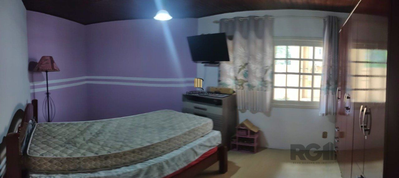 casa com 4 dormitórios, sendo 1 suíte, garagem para dois carros fechada, no bairro Santa Isabel em Viamão