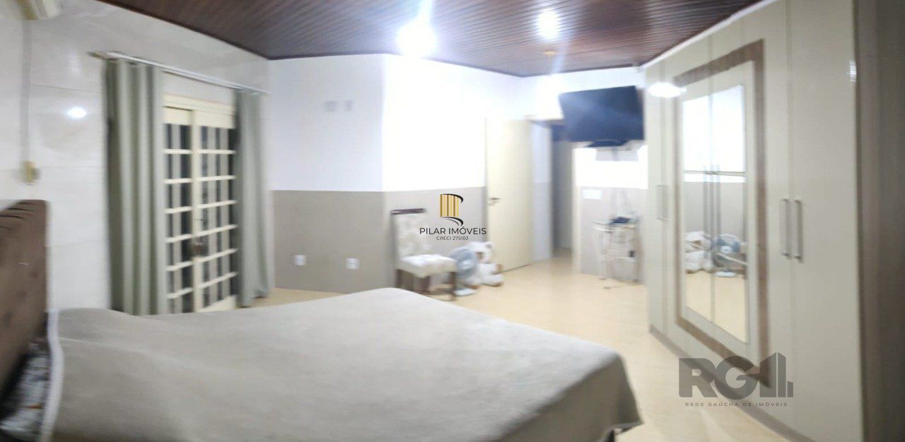 casa com 4 dormitórios, sendo 1 suíte, garagem para dois carros fechada, no bairro Santa Isabel em Viamão