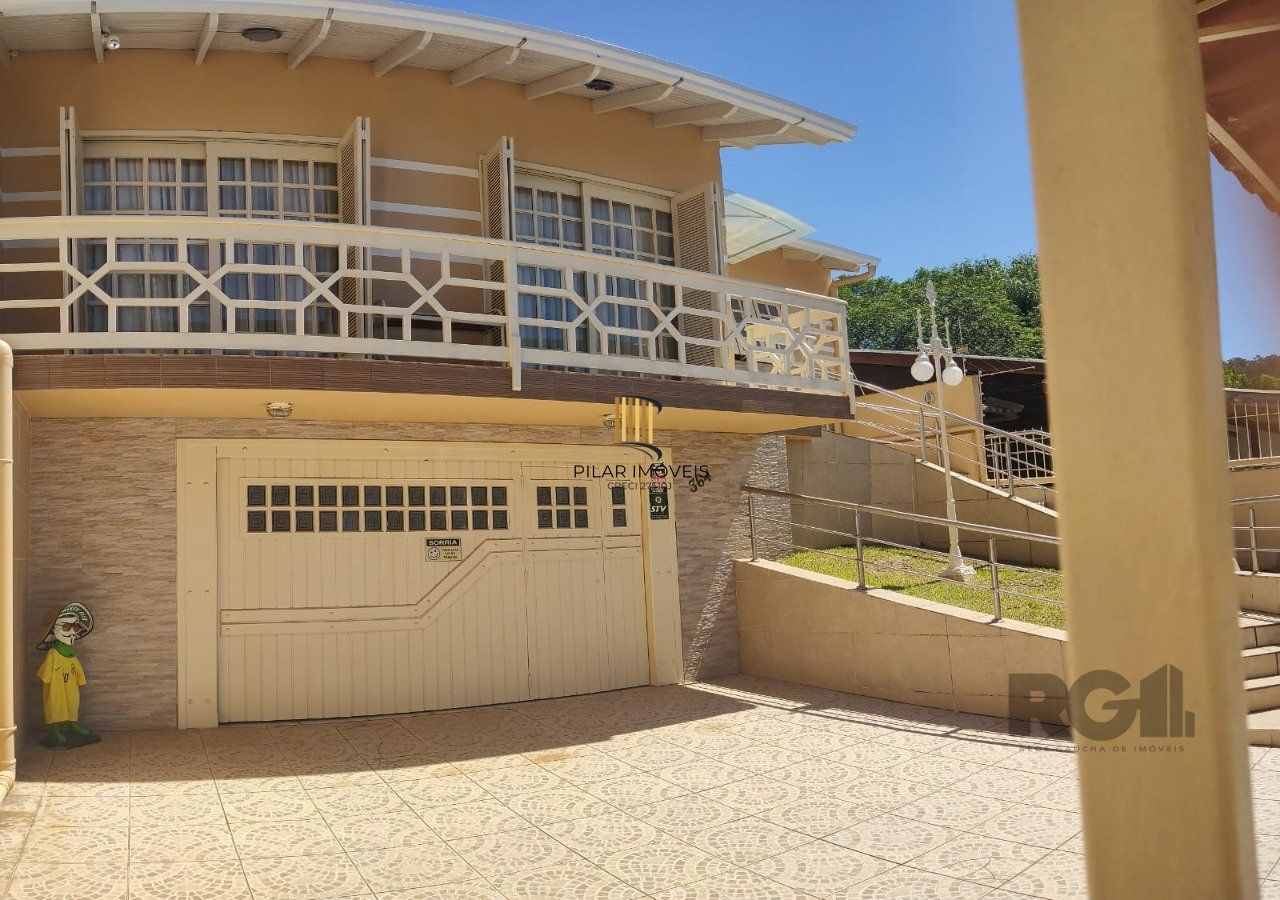 casa com 4 dormitórios, sendo 1 suíte, garagem para dois carros fechada, no bairro Santa Isabel em Viamão
