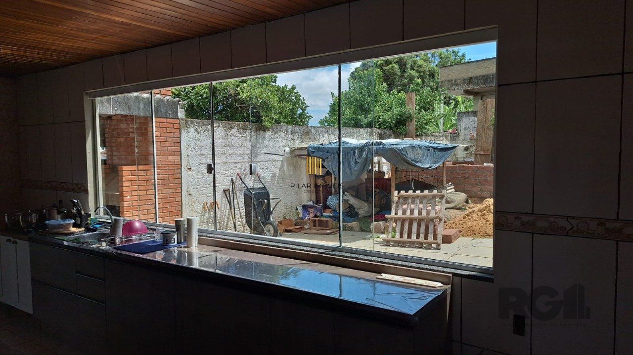 Terreno com casa com 3 quartos, vaga de garagem, no bairro Ipanema, Porto Alegre/RS