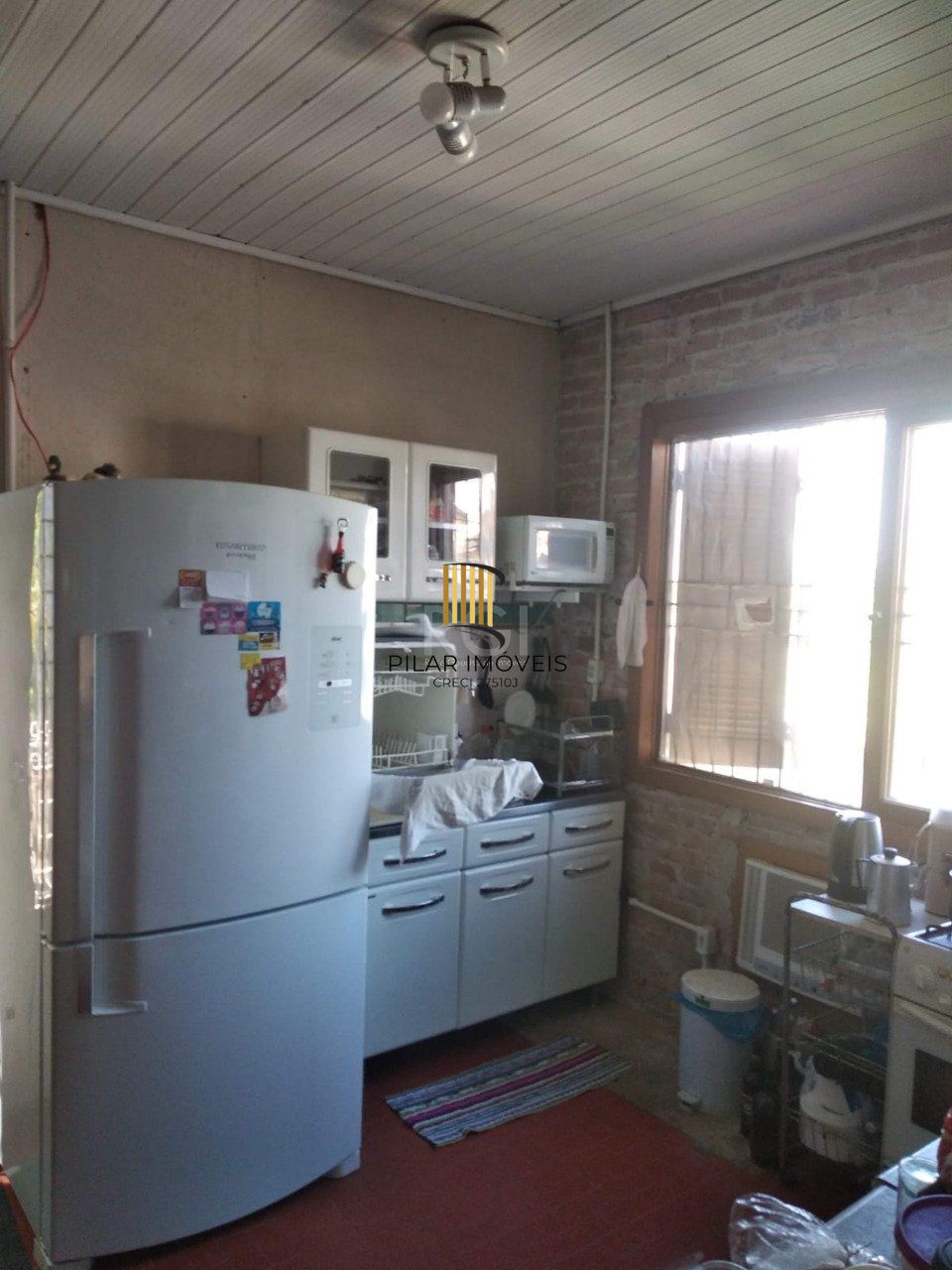 Casa 2 dormitórios, sala, banheiro garagem coberta, terreno 694m² bairro Camaquã, Porto Alegre/RS