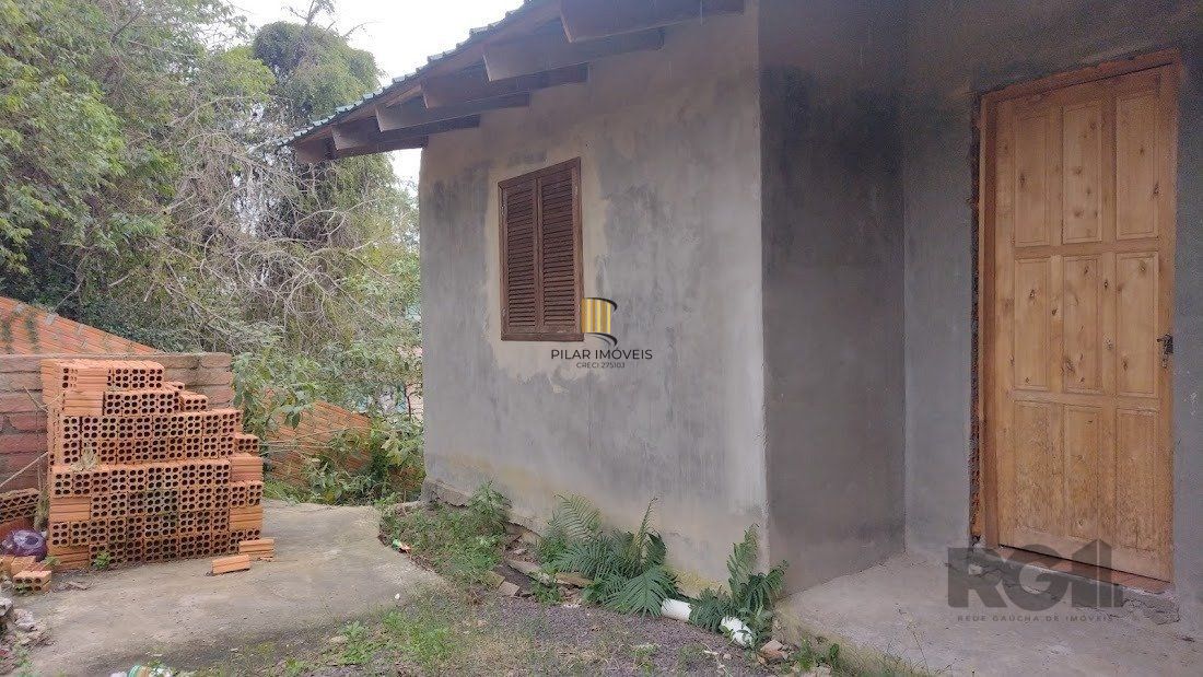 Casa de dois dormitórios localizada no Bairro Nonoai