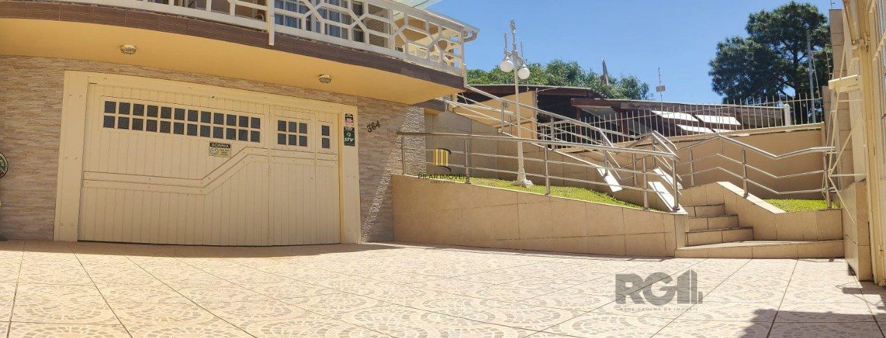 casa com 4 dormitórios, sendo 1 suíte, garagem para dois carros fechada, no bairro Santa Isabel em Viamão