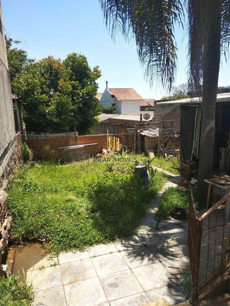 Casa 2 dormitórios, sala, banheiro garagem coberta, terreno 694m² bairro Camaquã, Porto Alegre/RS