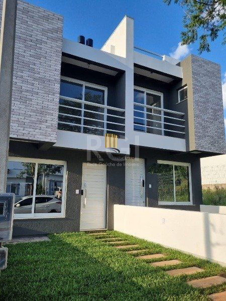 Casa 3 dormitórios no bairro Guarujá