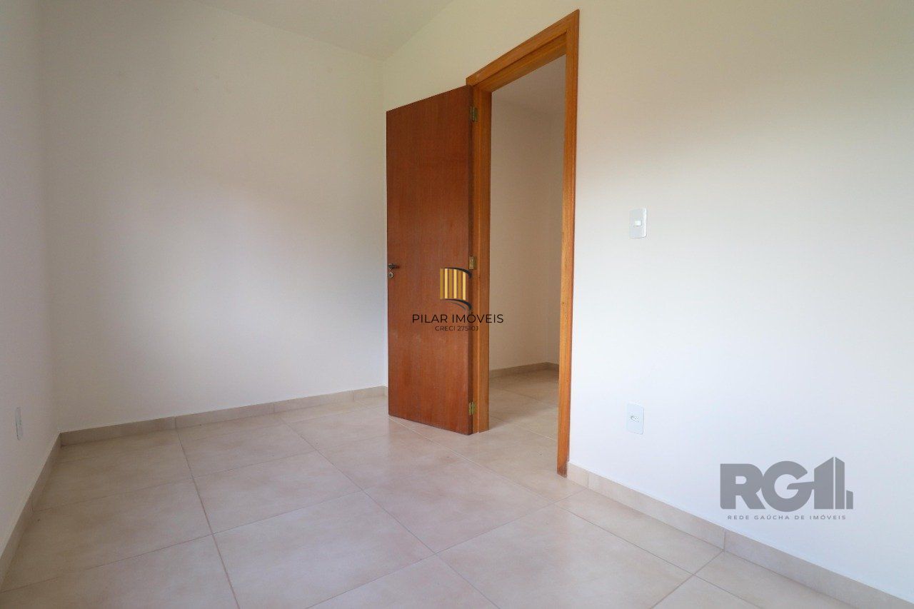 CASA ESTILO SOBRADO COM 2 QUARTOS E PÁTIO, À VENDA NO BAIRRO VILA NOVA, EM PORTO ALEGRE/RS