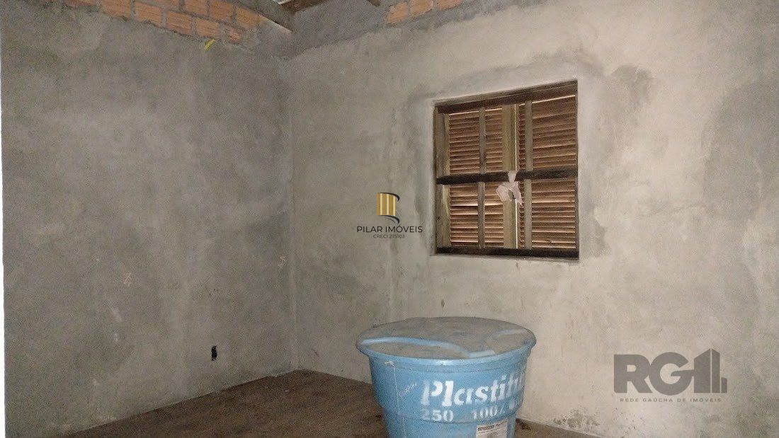 Casa de dois dormitórios localizada no Bairro Nonoai