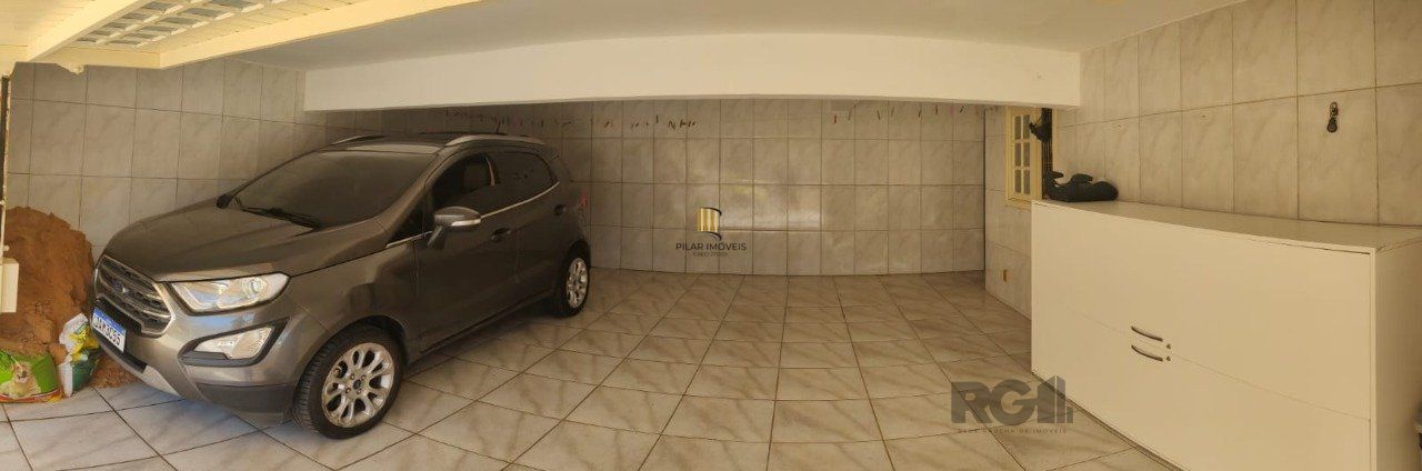 casa com 4 dormitórios, sendo 1 suíte, garagem para dois carros fechada, no bairro Santa Isabel em Viamão