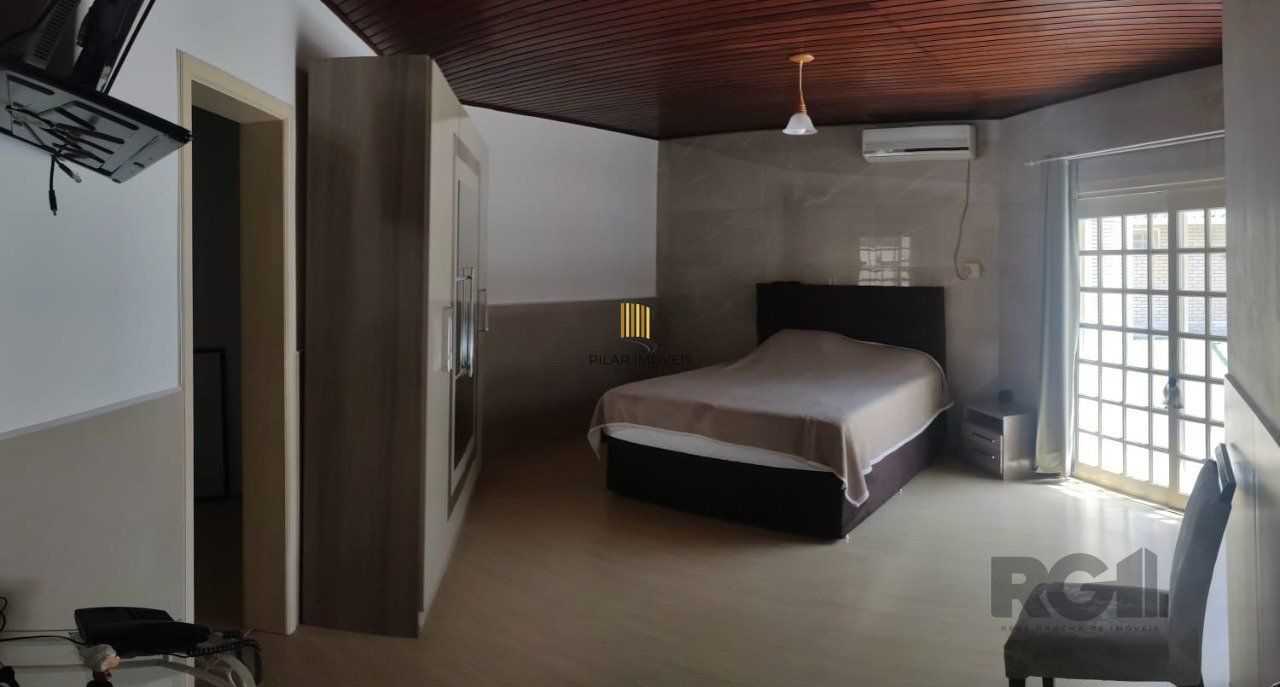 casa com 4 dormitórios, sendo 1 suíte, garagem para dois carros fechada, no bairro Santa Isabel em Viamão