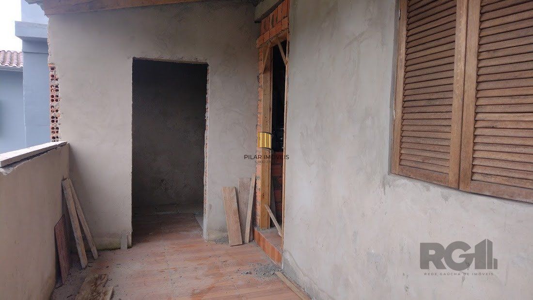 Casa de dois dormitórios localizada no Bairro Nonoai