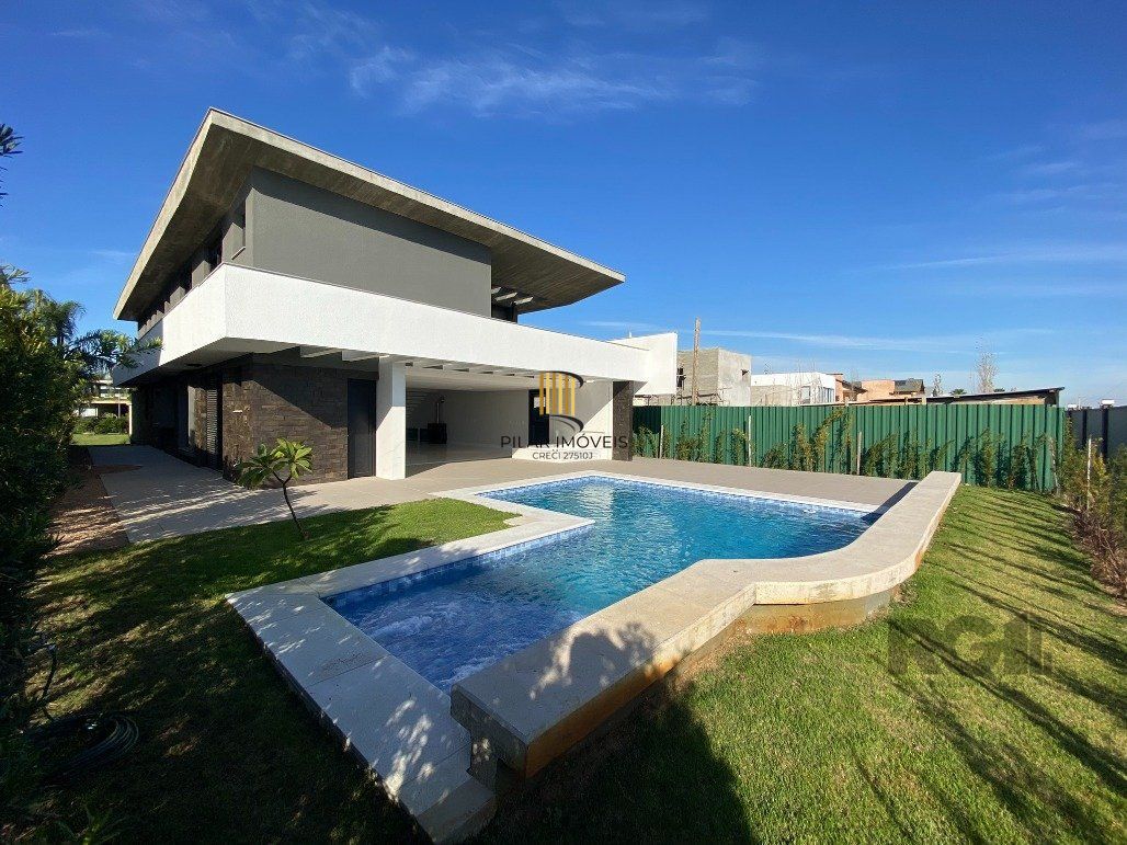 Casa para comprar no Condomínio Ponta da Figueira - Marina com 4 Suítes