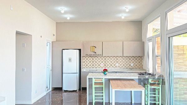 Casa Condominio em Porto Alegre, no bairro Hípica, com 3 dormitório(s), e 3 banheiros, à venda.