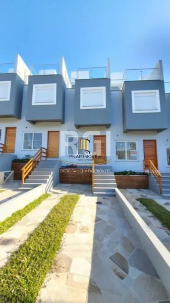 Casa 3 dormitórios no bairro Guarujá