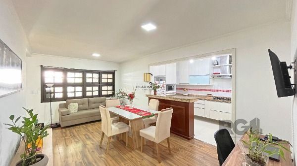 Casa 4 dormitórios no bairro Camaquã