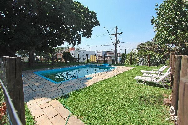 Casa Condominio em Porto Alegre, no bairro Hípica, com 3 dormitório(s), e 3 banheiros, à venda.