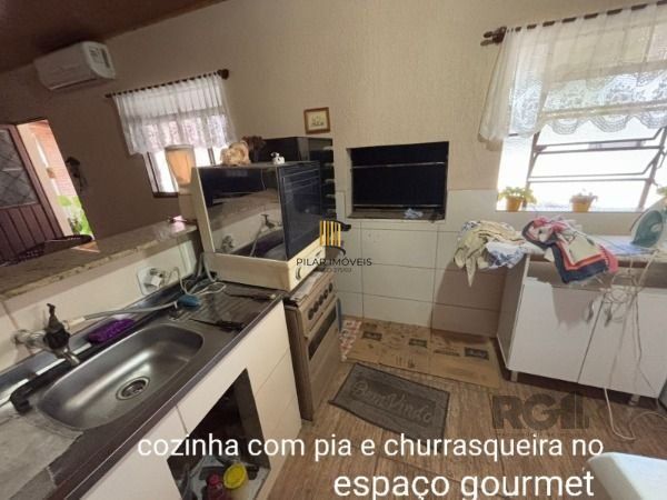 Casa 3 dormitórios no bairro Camaquã