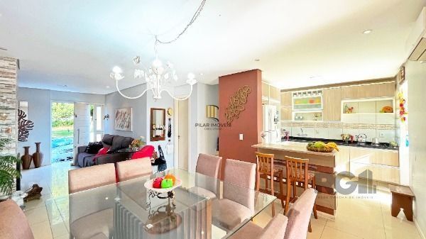 Casa Condominio em Porto Alegre, no bairro Vila Nova, com 3 dormitório(s), e 3 banheiros, à venda.