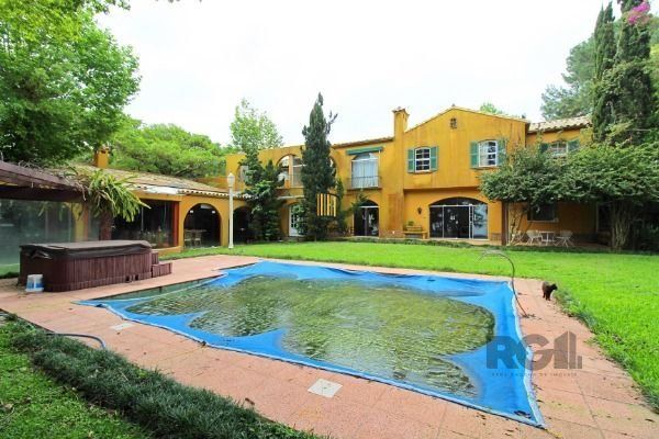 Casa em Porto Alegre, no bairro Pedra Redonda, com 7 dormitório(s), e 7 banheiros, à venda.