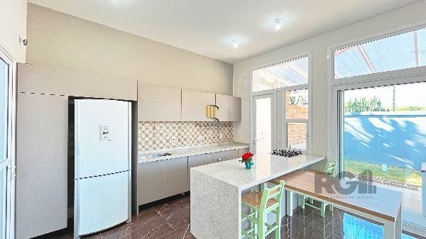 Casa Condominio em Porto Alegre, no bairro Hípica, com 3 dormitório(s), e 3 banheiros, à venda.