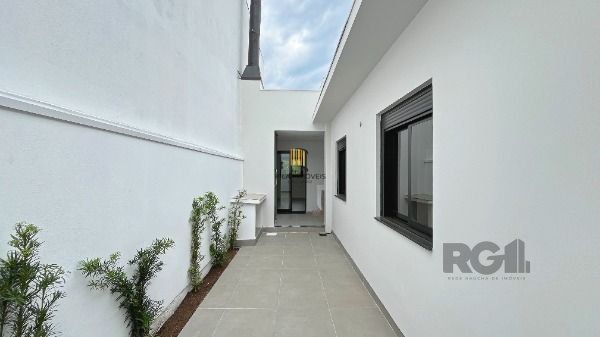 Casa em Porto Alegre, no bairro Hípica, com 3 dormitório(s), e 3 banheiros, à venda.