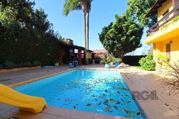 Casa Condominio em Porto Alegre, no bairro Cavalhada, com 4 dormitório(s), e 4 banheiros, à venda.