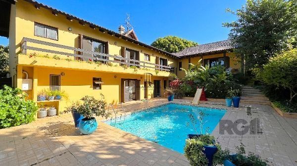 Casa Condominio em Porto Alegre, no bairro Cavalhada, com 4 dormitório(s), e 4 banheiros, à venda.