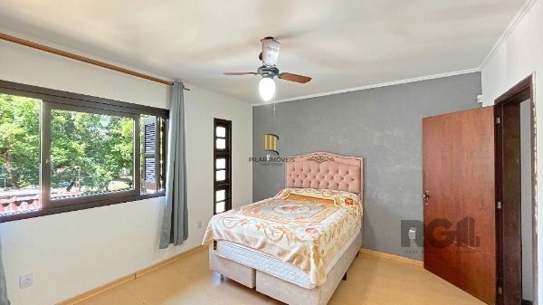 Casa 4 dormitórios no bairro Camaquã