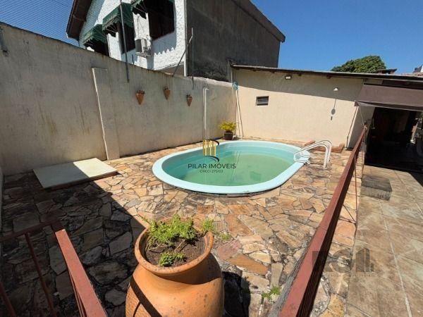 Casa 3 dormitórios no bairro Camaquã