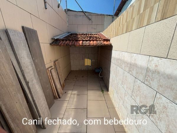 Casa 3 dormitórios no bairro Camaquã