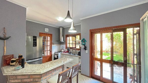 Casa em Porto Alegre, no bairro Hípica, com 3 dormitório(s), e 2 banheiros, à venda.