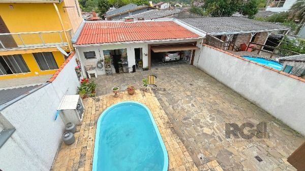 Casa em Porto Alegre, no bairro Aberta dos Morros, com 3 dormitório(s), à venda.