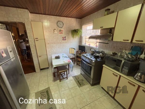 Casa 3 dormitórios no bairro Camaquã