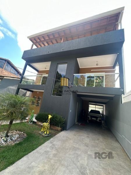 Casa 5 dormitórios no bairro Lomba do Pinheiro - Pilar Imóveis