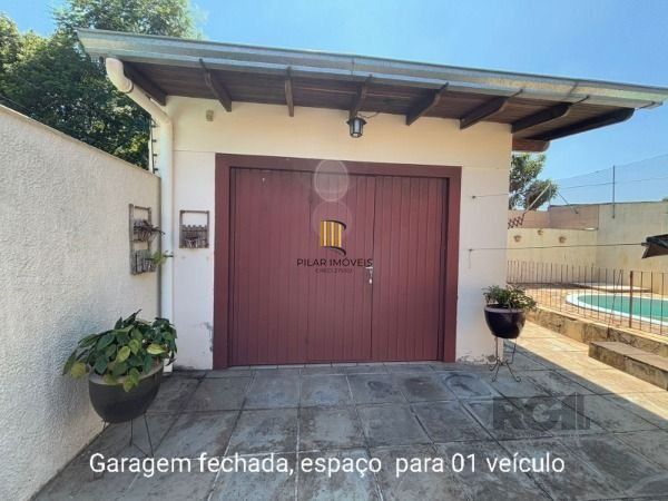 Casa 3 dormitórios no bairro Camaquã