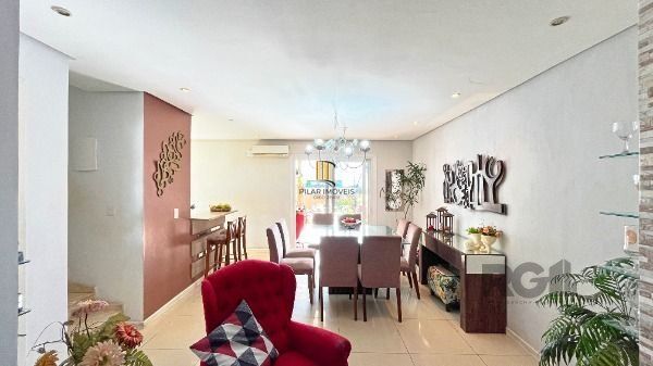 Casa Condominio em Porto Alegre, no bairro Vila Nova, com 3 dormitório(s), e 3 banheiros, à venda.