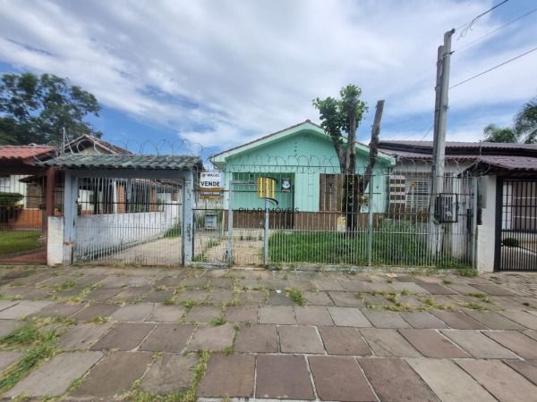 Casa 4 dormitórios no bairro Camaquã