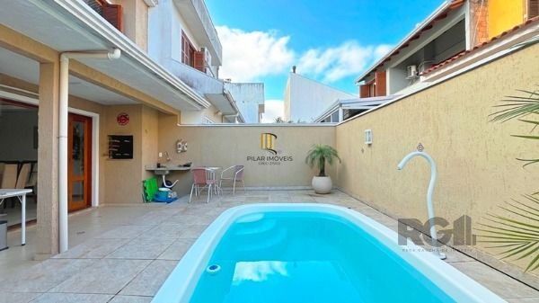 Casa em Porto Alegre, no bairro Hípica, com 3 dormitório(s), e 3 banheiros, à venda.