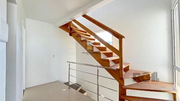 Casa Condominio em Porto Alegre, no bairro Ipanema, com 3 dormitório(s), e 3 banheiros, à venda.