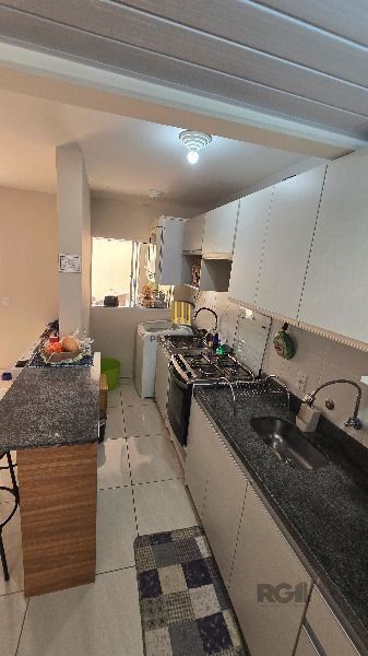 Casa Condominio em Porto Alegre, no bairro Hípica, com 3 dormitório(s), e 3 banheiros, à venda.