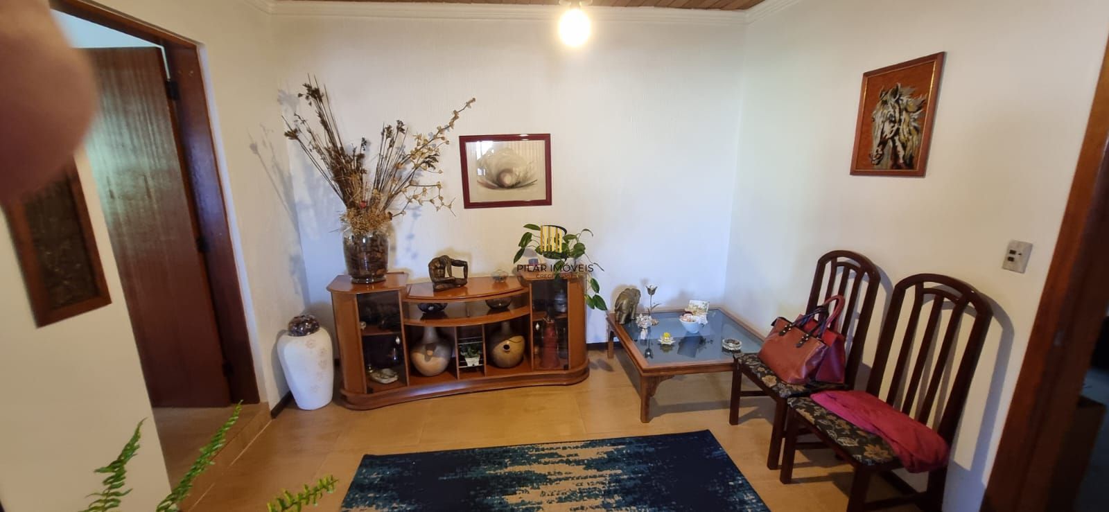 Casa com pavilhão