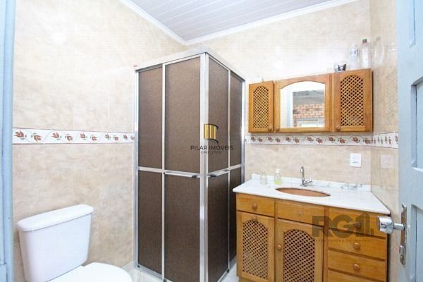 Casa em Porto Alegre, no bairro Belém Novo, com 3 dormitório(s), e 3 banheiros, à venda.