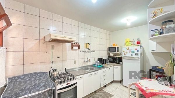 Casa Condominio em Porto Alegre, no bairro Tristeza, com 3 dormitório(s), e 3 banheiros, à venda.