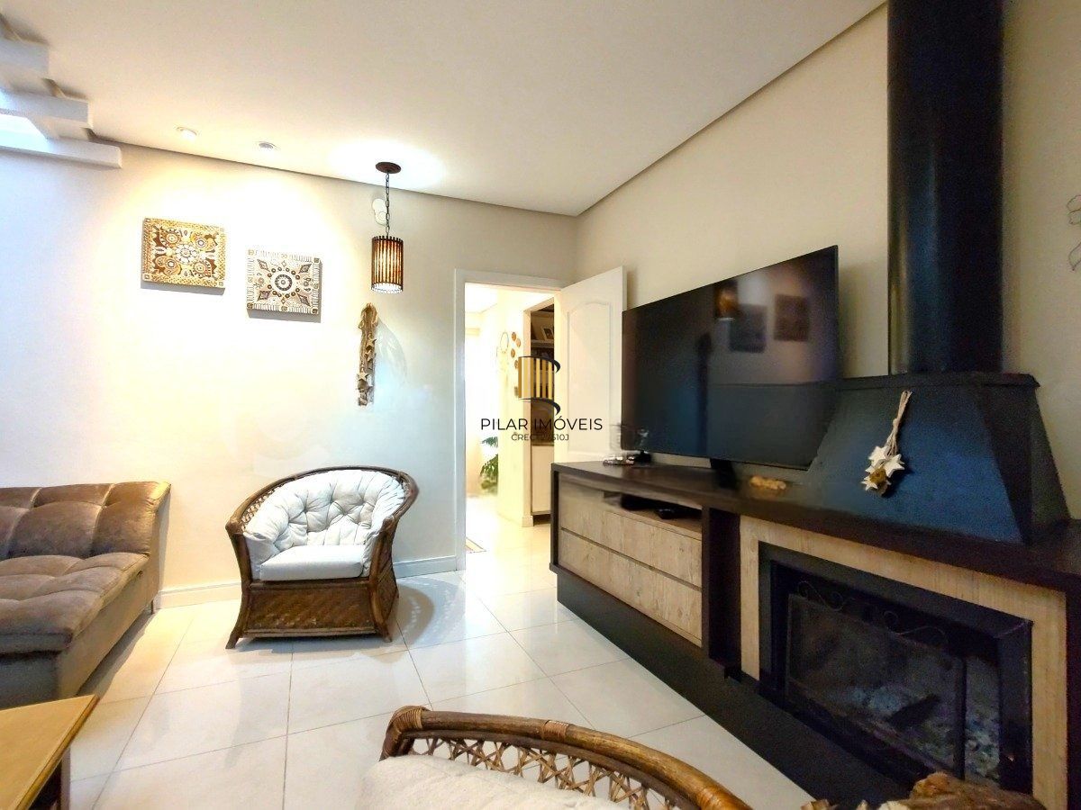 Casa com 4 dormitórios, espaço gourmet e terraço na Zona Norte de Porto Alegre