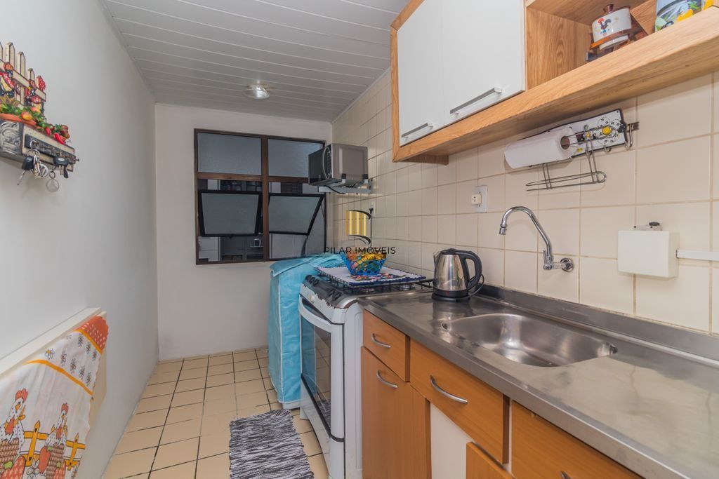 Apartamento iluminado com 2 dormitórios e vaga escriturada