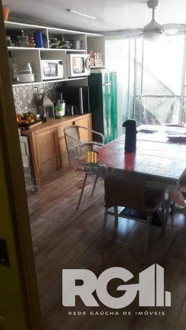 Casa residencial com 3 dormitórios 90m² privativos, e 2 vagas à venda no bairro Parque Santa Fé em Porto Alegre