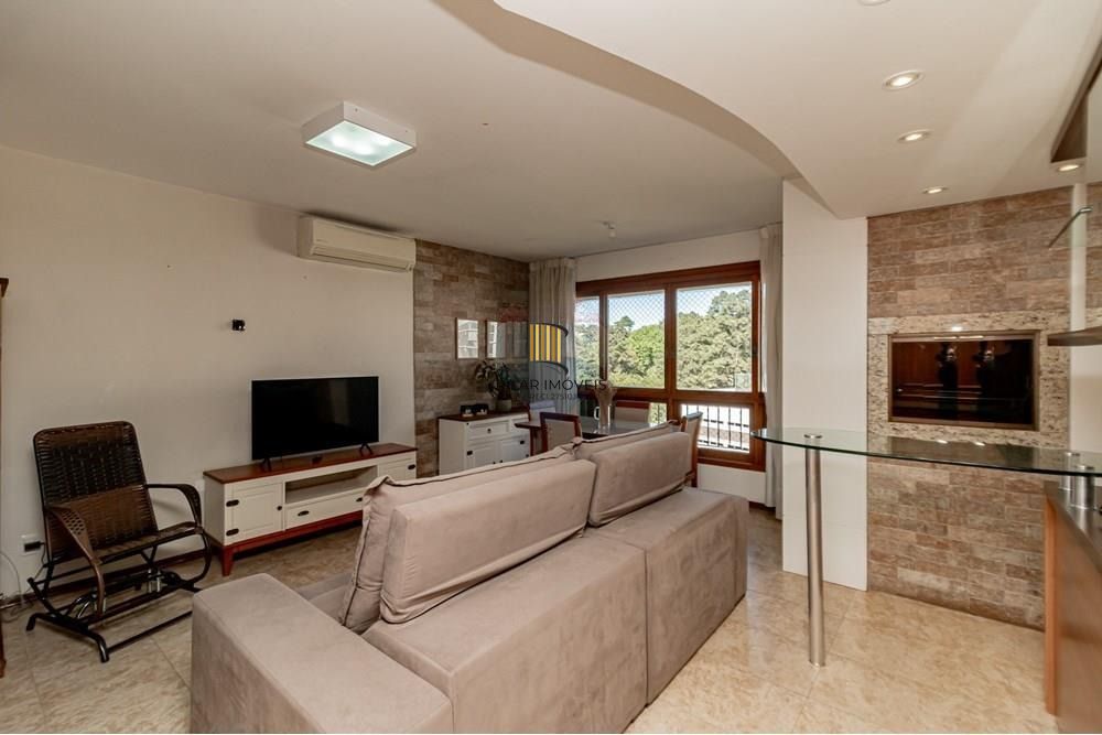 Apartamento com 3 dormitórios (sendo 1 suíte), 2 banheiros, lareira, churrasqueira e 2 vagas de garagem.