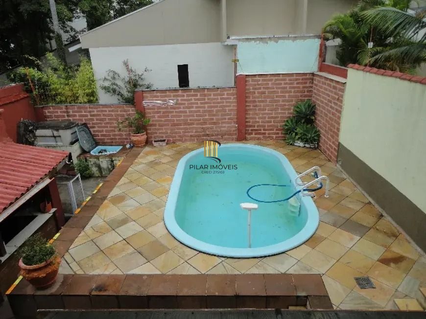 Casa com três dormitórios, suíte, piscina e 3 vagas. - Pilar Imóveis
