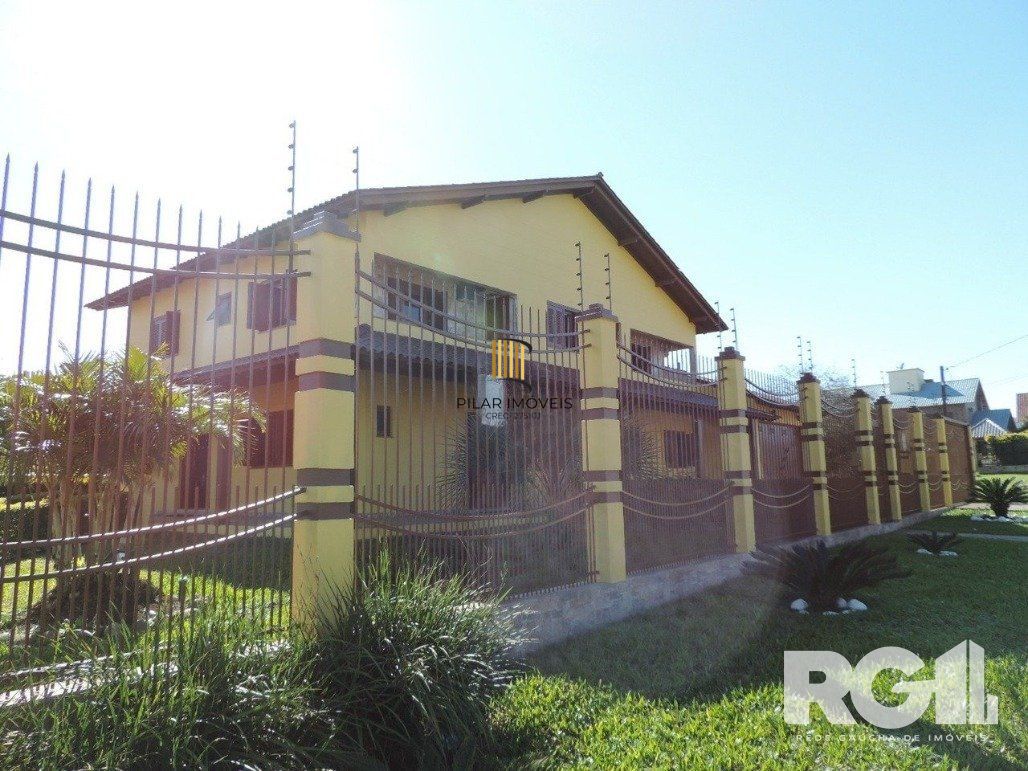 Casa 4 dormitórios no bairro Parque Santa Fé - Pilar Imóveis