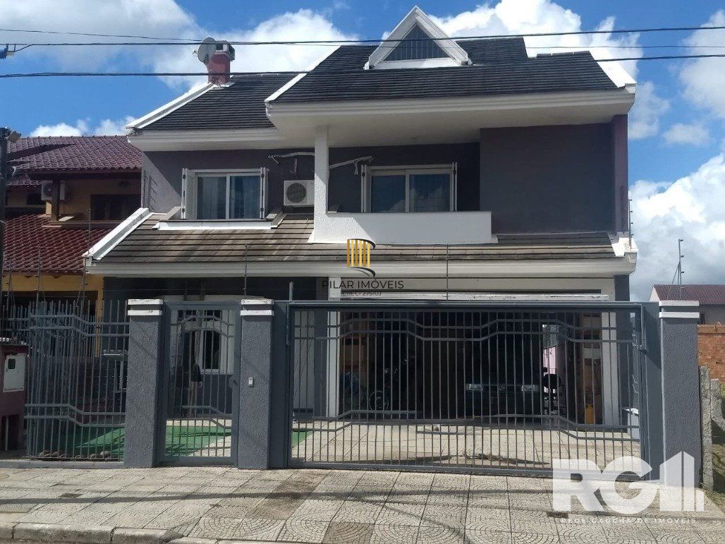 Casa 4 dormitórios no bairro Parque Santa Fé - Pilar Imóveis