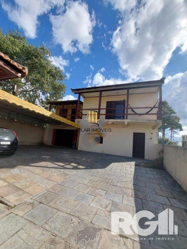 Linda Residência com cinco dormitórios no centro da cidade de Viamão/RS